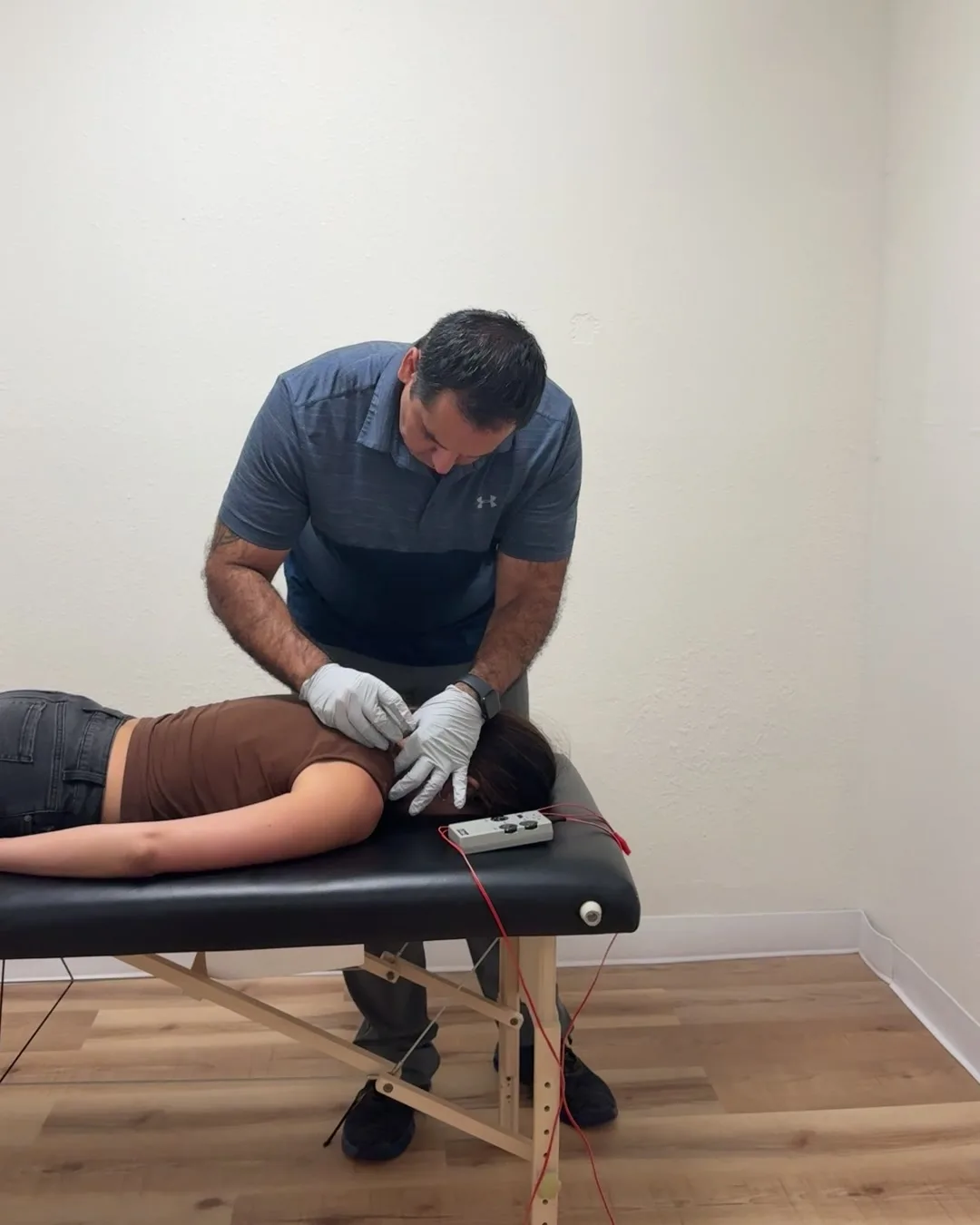 Dr. Andrew Cisneros, PT, DPT performing dry needling on the cervical spine at Solas Physical Therapy, 300 N Resler Dr, El Paso TX